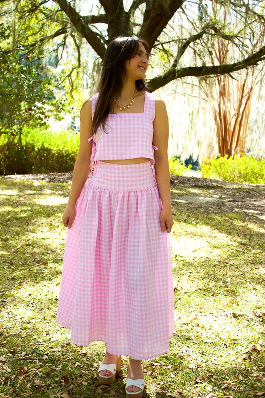 Pink gingham crop top and long skirt set, made from lightweight fabric, perfect for summer outings.