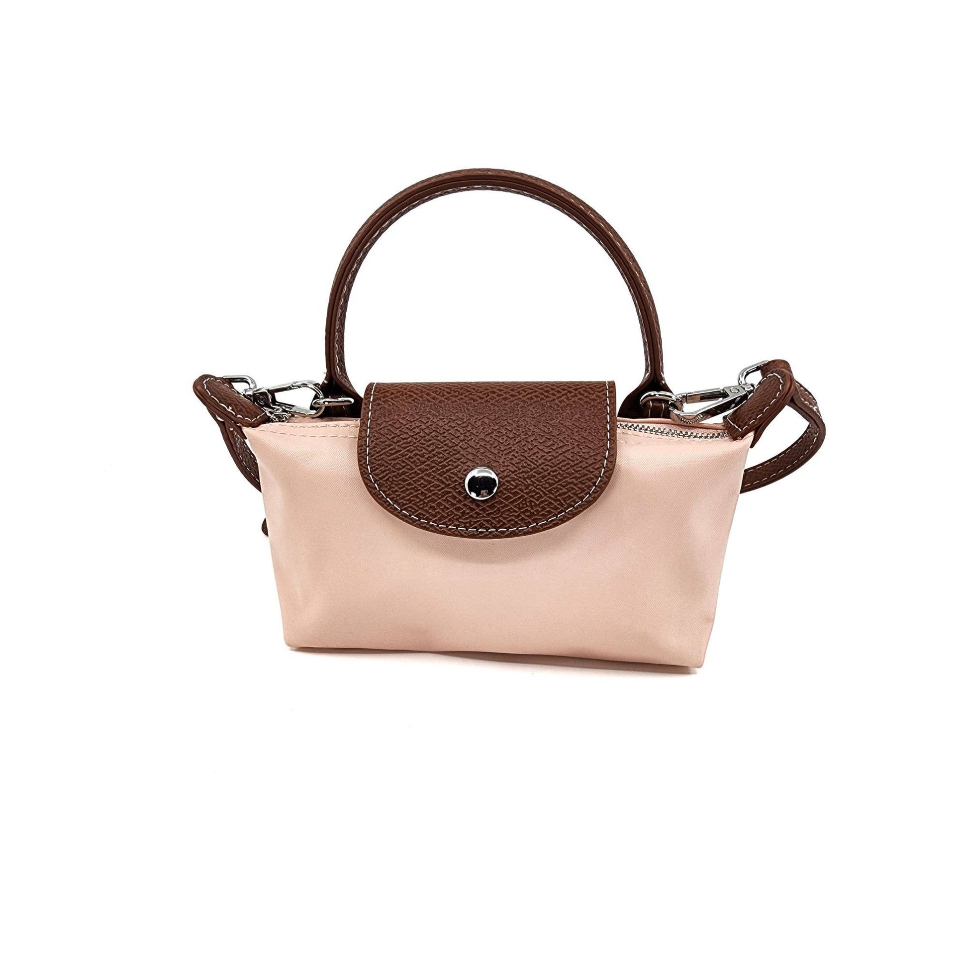 Handbag with beige body and brown handle and flap on a white background